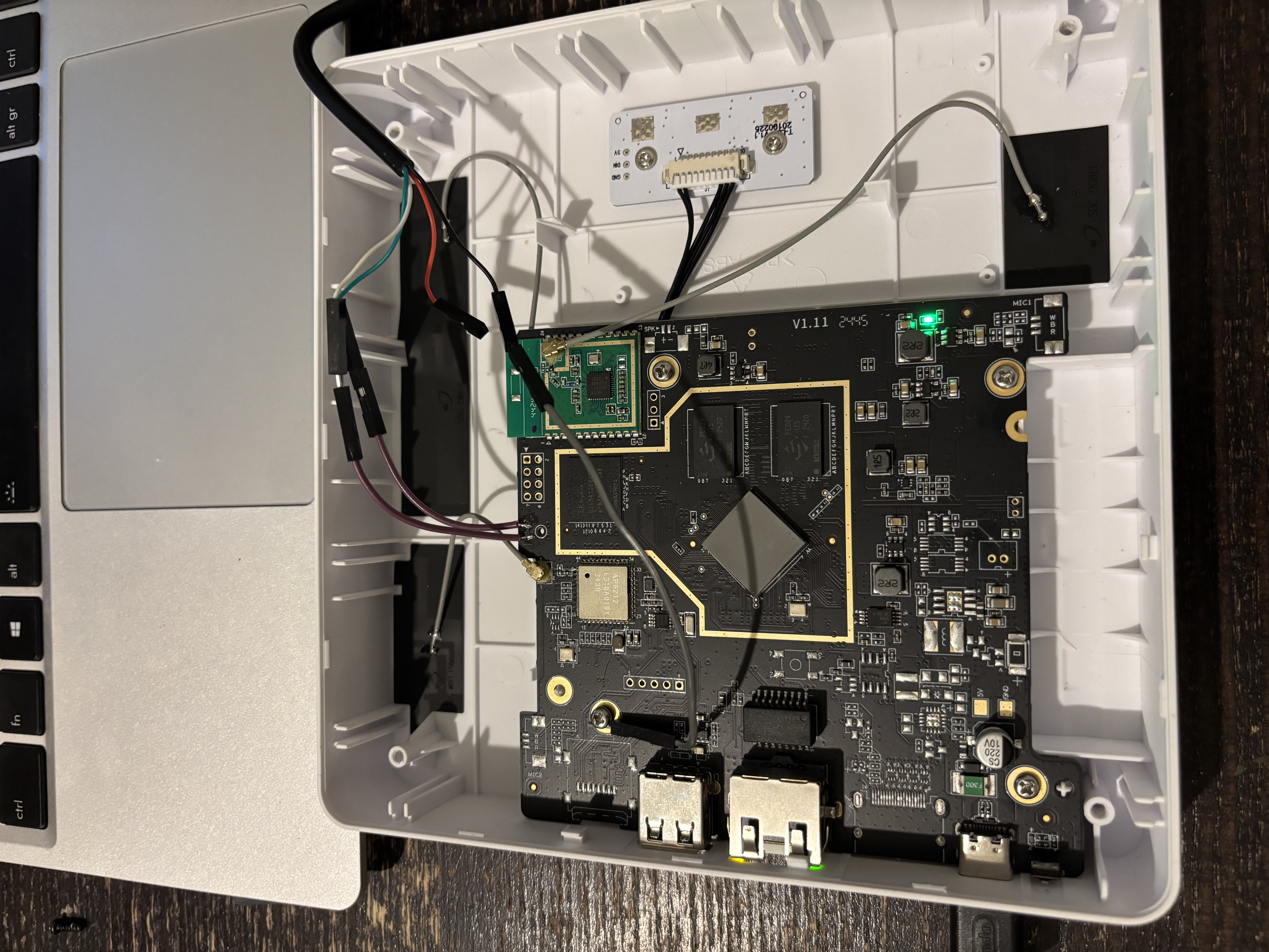 UART pads hidden under silkscreen on the PCB edge